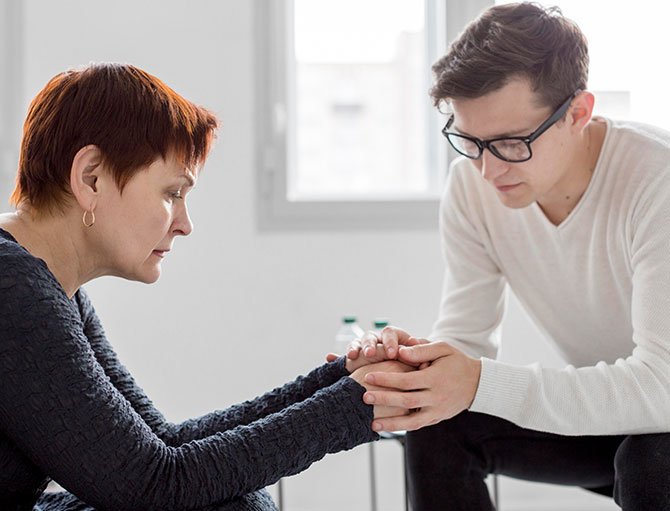 Emotionally connected couple in a therapy setting at The Guidance House, showcasing support during a vulnerable moment.